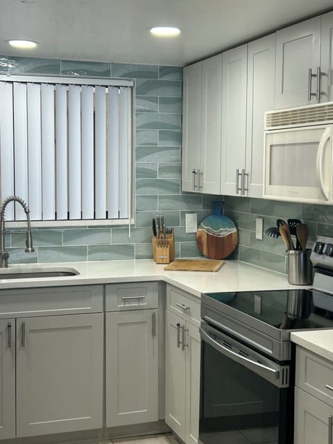 Fully equipped kitchen with brand new cabinets and appliances.