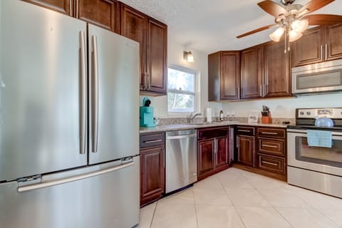 Features large fridge, dishwasher, full range, Keurig, Countertop Ice Maker