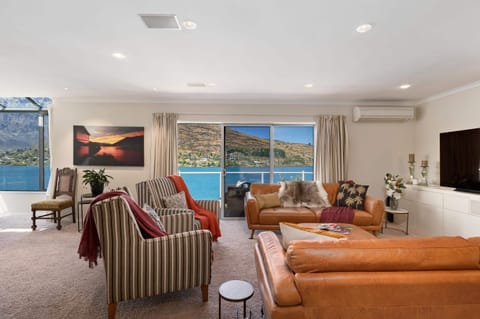 Living Room: Bask in stunning views from plush seating, perfect for relaxation after adventures!