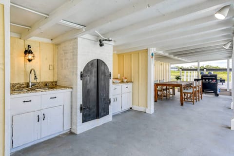 Choose between smoking or grilling your favorite meat in this outdoor kitchen.