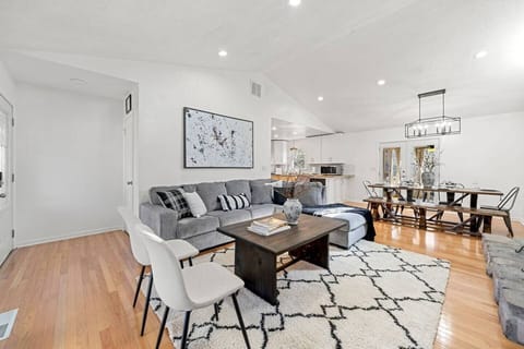 Step into a world of spacious comfort! Our open concept design and soaring high ceilings create an airy atmosphere that invites you to unwind. Sink into our cozy living room, featuring a plush sofa that transforms into a dreamy Queen size bed.