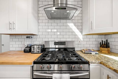 Cook with ease and everything at your fingertips in our well-equipped kitchen, stocked with everything you need to create a delicious feast. The kitchen features a gas range, providing the perfect heat for all your cooking needs.