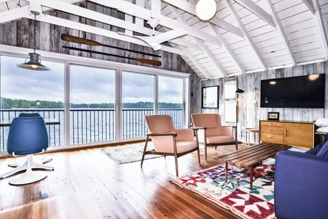 Floor to ceiling windows provide unobstructed, breathtaking lake views.