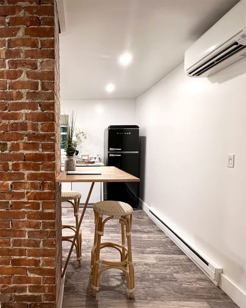 The space is maximized with a wraparound dining bar and mini split A/C