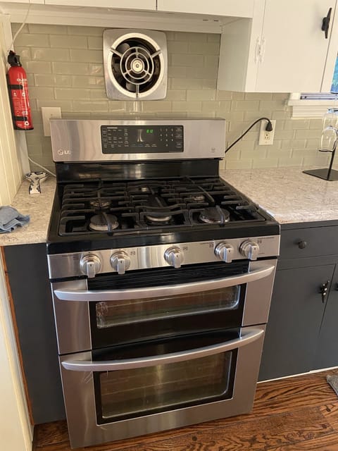 A double oven and a high end gas range is here for you.