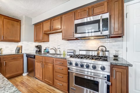 Viking range, dual sink with garbage disposal, and dishwasher