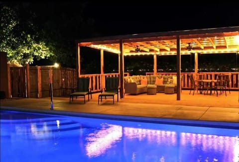 At night, the pool and poolside seating area give off a magical sapphire and golden glow!