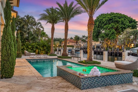 Delight in waterfront tranquility from the heated pool and hot tub.