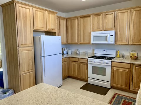 Full kitchen w/fridge, freezer, microwave, stove, oven, coffee pot, dishwasher..