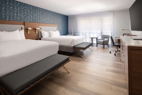 Enjoy extra space to unpack and relax beside plush beds.