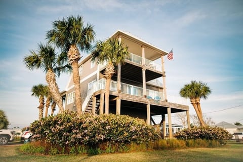 Crane Cottage is beach luxury just steps from the white sand of the gulf!