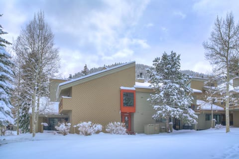 Charming exterior surrounded by fresh mountain snow.