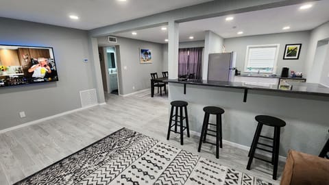 Living Room with open design into Kitchen and Dining Room. 