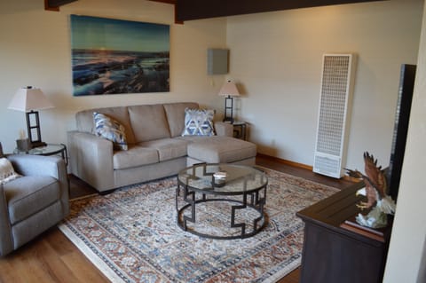 Comfortable living room with a reclining accent chair and  chaise lounge/sofa