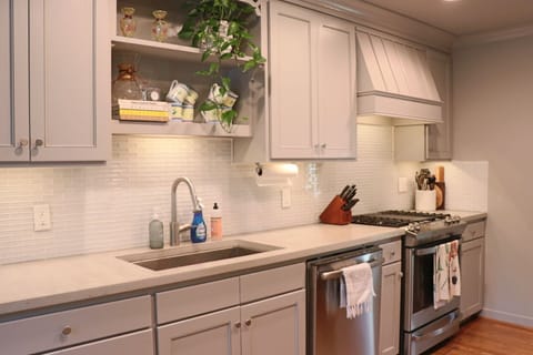 Kitchen view- large sink and gas stove top. Lots of amenities & cooking supplies