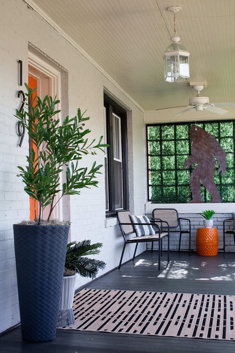 Inviting cozy front porch seating area Smart Keyless lock for easy entry anytime