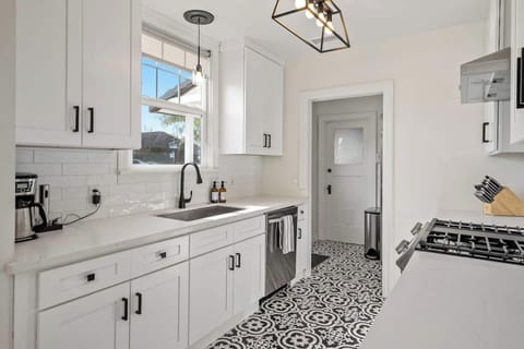 Newly renovated kitchen with stainless steel appliances - includes coffee machine and wine opener for guests