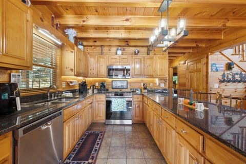 Fully stocked kitchen with granite countertops and stainless appliances for easy vacation cooking
