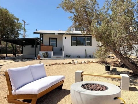 Fire pit, car port & front porch with horse shoe driveway