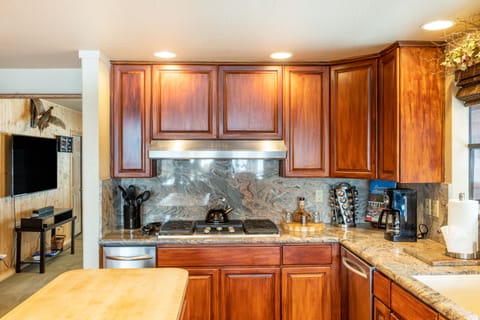 Gas range and coffee corner in the kitchen.