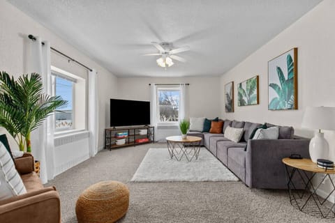 Spacious and comfortable living area. Large windows allow natural light to stream in and brighten the entire room.