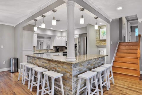 Open kitchen area with everything you need to make any gourmet meal along with additional 7 bar stools to eat around the enormous kitchen island. 