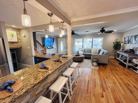 If the dining room table of 6 isn't enough room, you can spread out at the enormous island with an additional 7 bar stools to sit at too. 