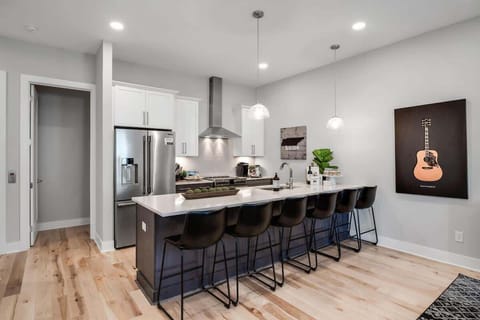 Fully stocked kitchen with a 6-seater island for meal prep and hangouts.