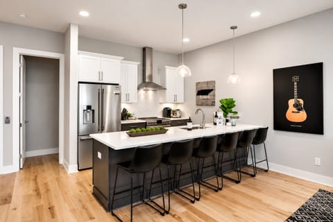 Fully stocked kitchen with a 6-seater island for meal prep and hangouts.