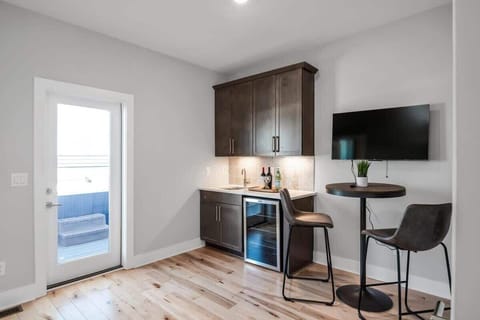 Top floor wet bar area that leads to the rooftop patio.