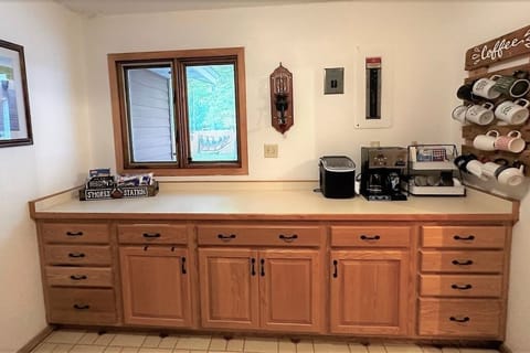 Hallway between rec room and kitchen.  Home of coffee & tea bar. 