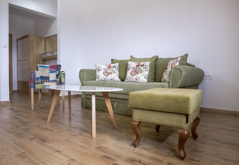 Comfy sofa with armchair. We did our best to make a nice, warm place for you!