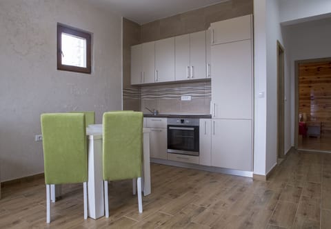 Modern and elegant kitchen shares the space with dining area.