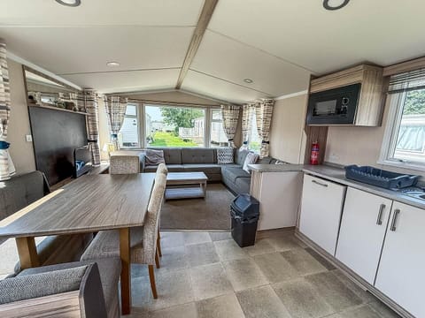The dining table in our caravan offers more than just a place to eat; it is a venue for reliving your traditional seaside fun