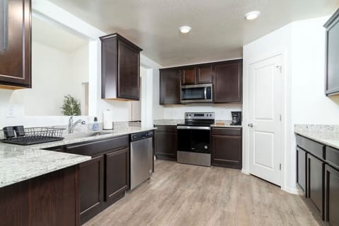 Whip up your favorite meals with ease in our fully-equipped and spacious kitchen.