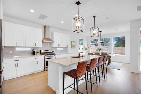 The dining room is bathed in natural light, creating a bright and inviting space where every meal feels special.