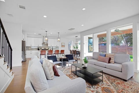 You feel at home as you settle into the living room, where the inviting atmosphere is perfect for lounging or entertaining.