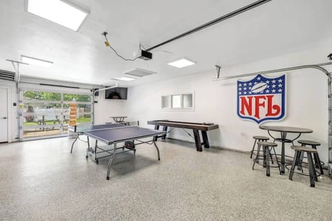 Heated garage area with ping pong, shuffle board and gaint connect four game.   Large screen TV to watch all your favorite shows and new glass garage door that gives you a fabulous view of Lambeau field.
