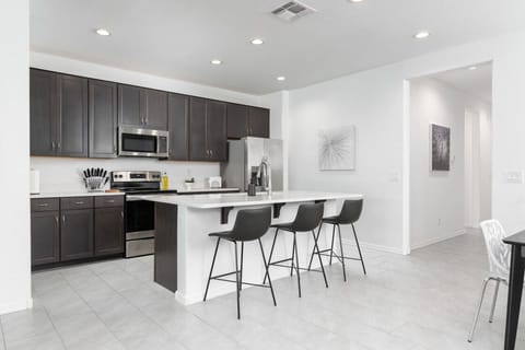 Have a few drinks at the kitchen island while watching the designated chef in action.