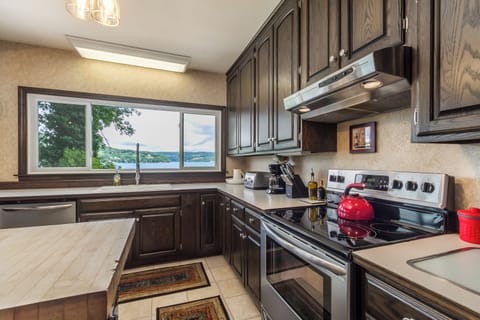 fully stocked kitchen with lake views. direct access to lower level deck.