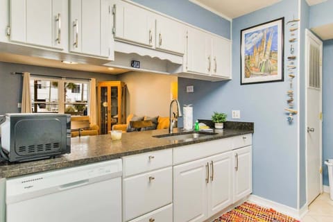 Dining bar and fully equipped kitchen for all your meal preparation needs.