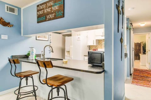 Dining bar and fully equipped kitchen for all your meal preparation needs.