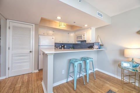  Embrace the tranquility of seaside living in this beautifully appointed 1-bedroom condo. The updated kitchen gleams with modern appliances.