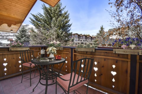 Just off the master bedroom is this charming private bistro patio with views of the Wasatch Back and the beautiful grounds of Zermatt