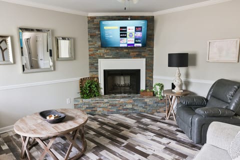 Nice Living room with a gorgeous stacked rock fireplace.
