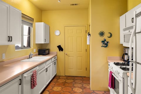 And a stacked washer and dryer in the kitchen for your convenience