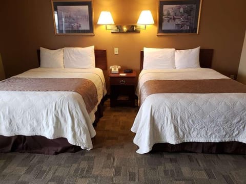 Drift off comfortably with matching beds and warm bedside lighting.