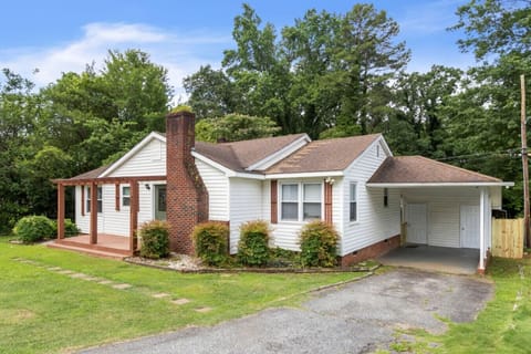 Charming Getaway: Enjoy serene views and a welcoming porch amidst lush greenery in Spartanburg!