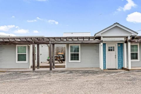 Front view of the home with covered entry and plenty of parking space.