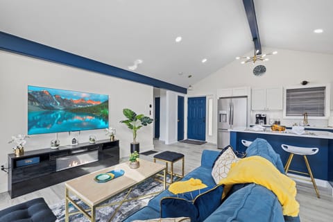 Living Room with Smart TV & Electric Fire Place.